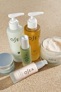 Skincare and body care products from the brand OSEA, including oils, serums, body butter, and a cleansing product.